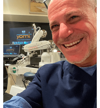 Dentist with dental robot in clinic
